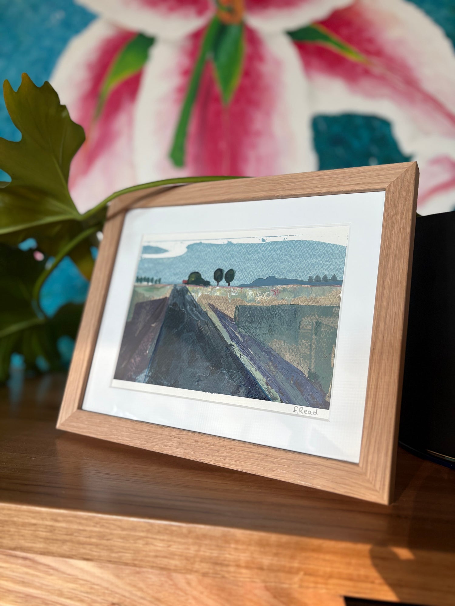 Landscape framed, infant of a large lily painting